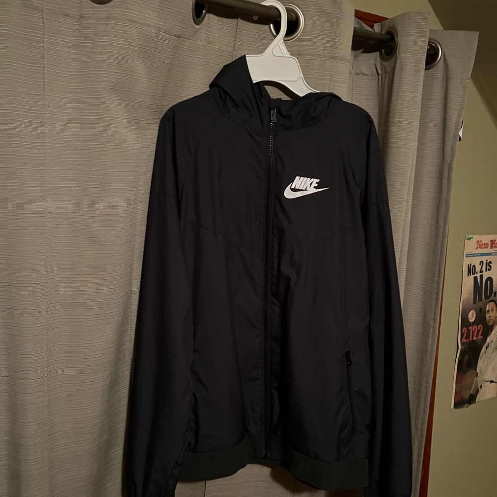 Black Nike windbreaker.